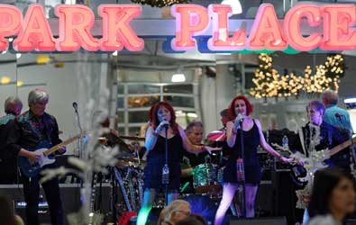 A band playing under a sign that reads Park Place