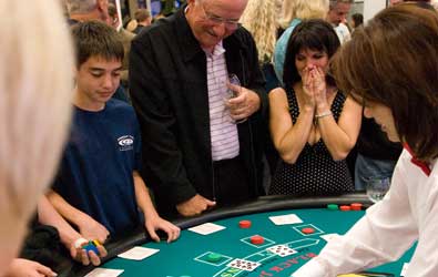 A child and man playng black jack